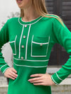 Knitted dress with sewn-on buttons