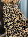 Long dress with leopard print and shiny accessories