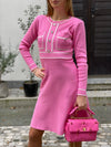 Knitted dress with sewn-on buttons