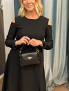 Dress with a cutout on the shoulders