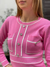 Knitted dress with sewn-on buttons