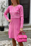 Knitted dress with sewn-on buttons