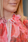 Blouse with floral print and embroidered details in several colors