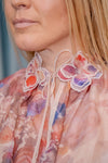 Blouse with floral print and embroidered details in several colors