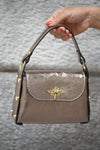 Leather bag with details on the side in several colors