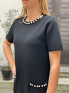 Dress with sewn beads in several colors