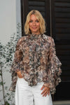Bluza z volani in cvetličnim potiskom