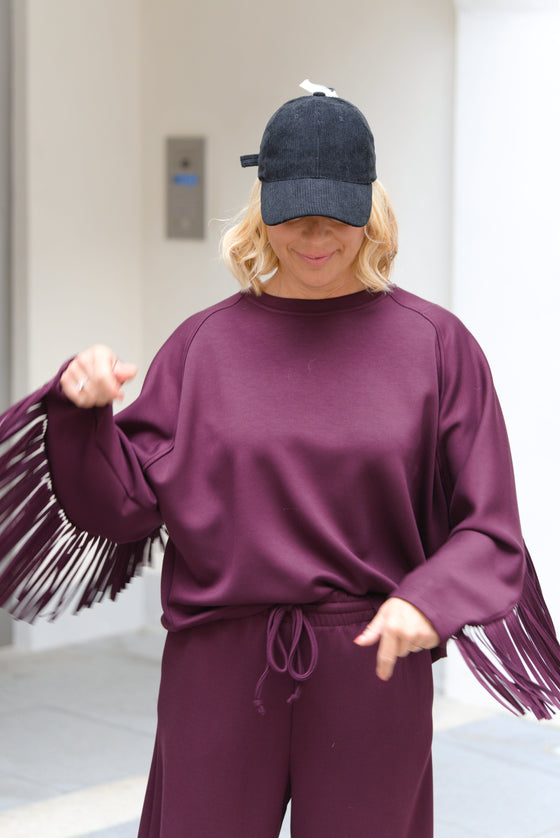 Pulover z resicami na rokavu v več barvah